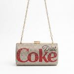 Load image into Gallery viewer, A rhinestone-covered clutch purse with a gold-tone chain strap and clasp, featuring the word 'Coke' in large red letters and 'Diet' in black script on the front, set against a plain white background.