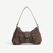 A vintage buckle shoulder bag in deep brown color with a sleek silhouette, featuring antique brass-tone buckles and a shoulder strap.