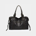 Load image into Gallery viewer, A vintage black leather handbag with gold-tone accents, featuring dual handles and a zipper closure.
