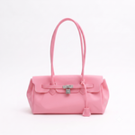 Load image into Gallery viewer, A light pink leather handbag with dual top handles, a front flap, and a silver-toned turn-lock clasp, photographed against a plain white background.
