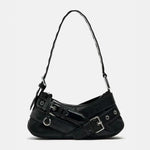 Load image into Gallery viewer, A sleek black faux leather shoulder bag featuring silver buckle details, eyelet embellishments, and an adjustable strap for a modern, edgy look.
